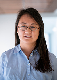 Mason bioengineering associate professor Qi Wei wears a light blue shirt and glasses with dark hair in her faculty profile 