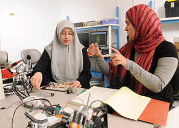 Salma Mahmoud and Sidra Khan in bioengineering lab.