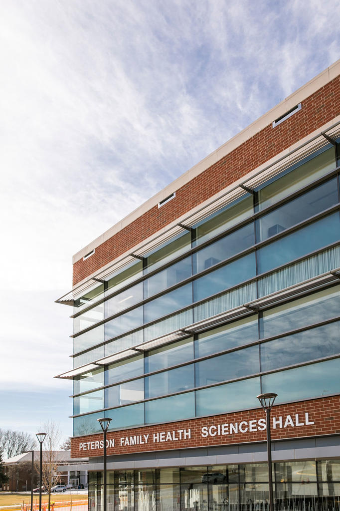 A daytime photo of the Peterson Family Health Sciences Hall building. 